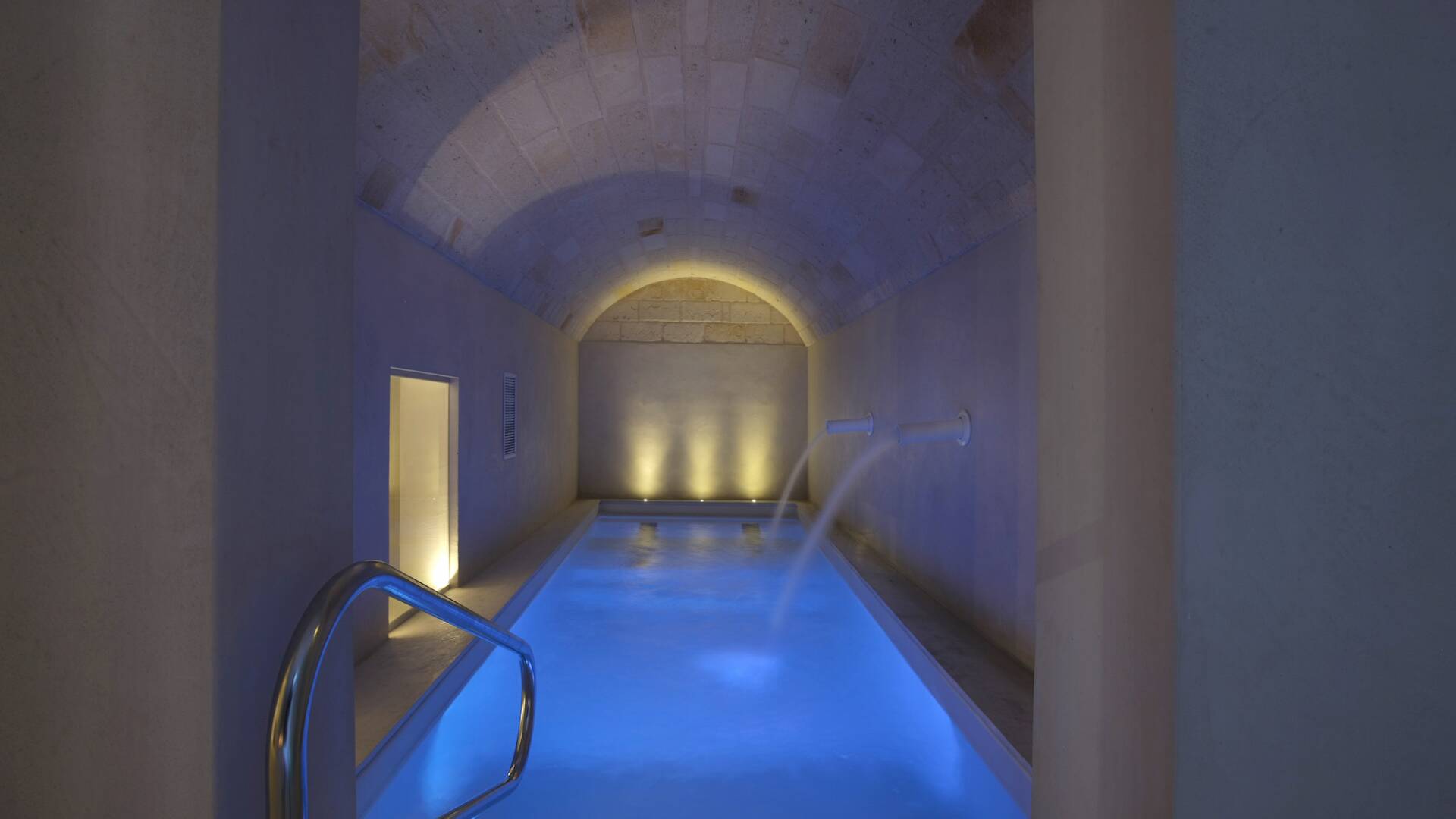 indoor pool with Jacuzzi corner