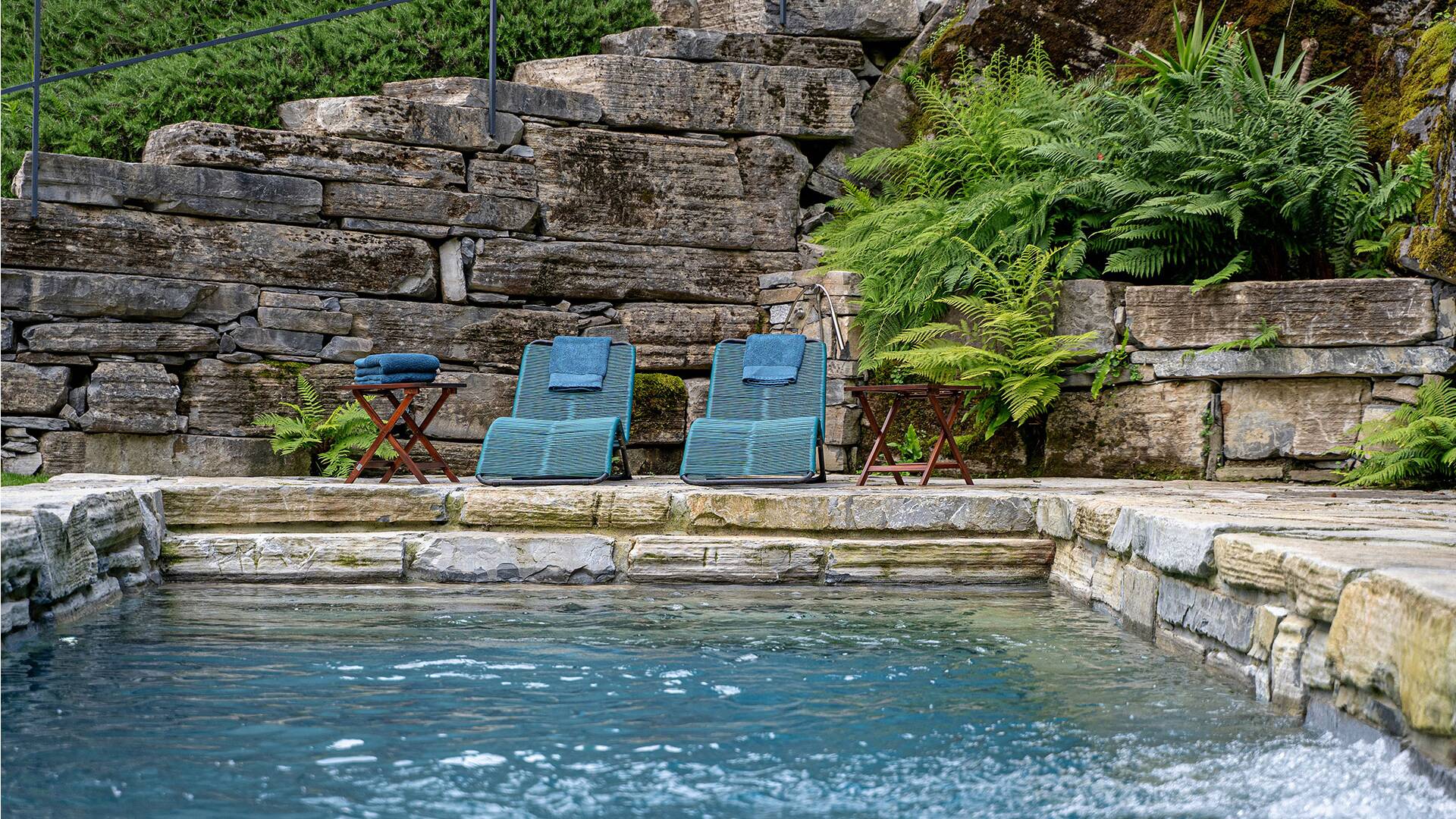 private pool with deckchairs