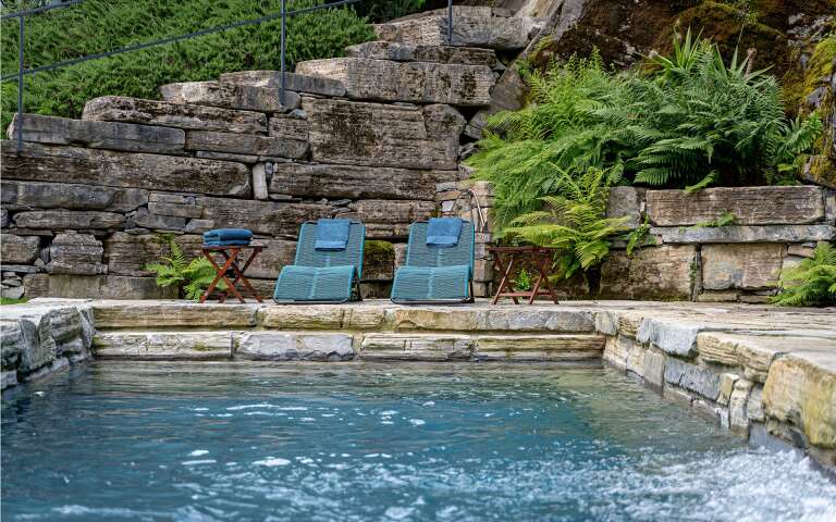 private pool with deckchairs