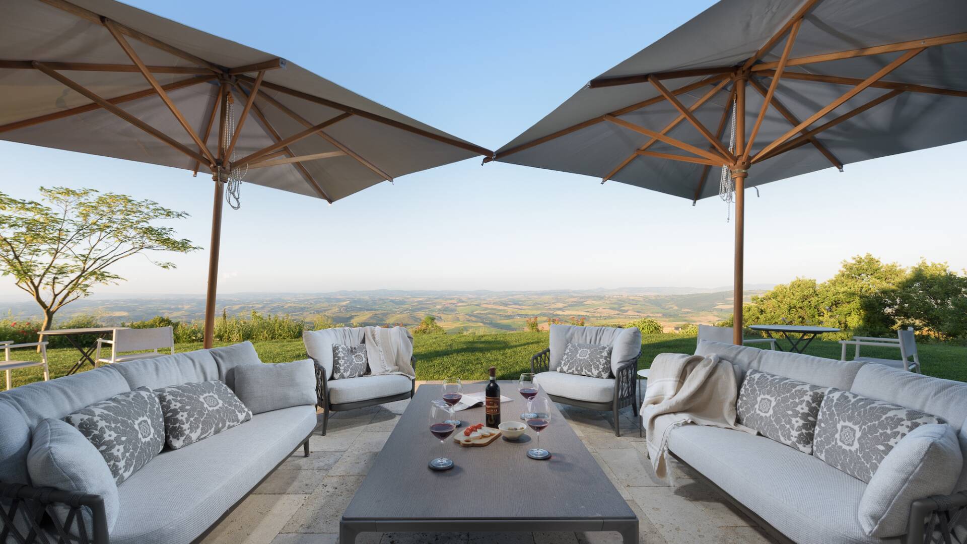 outdoor lounge area with view over the Tuscan hills