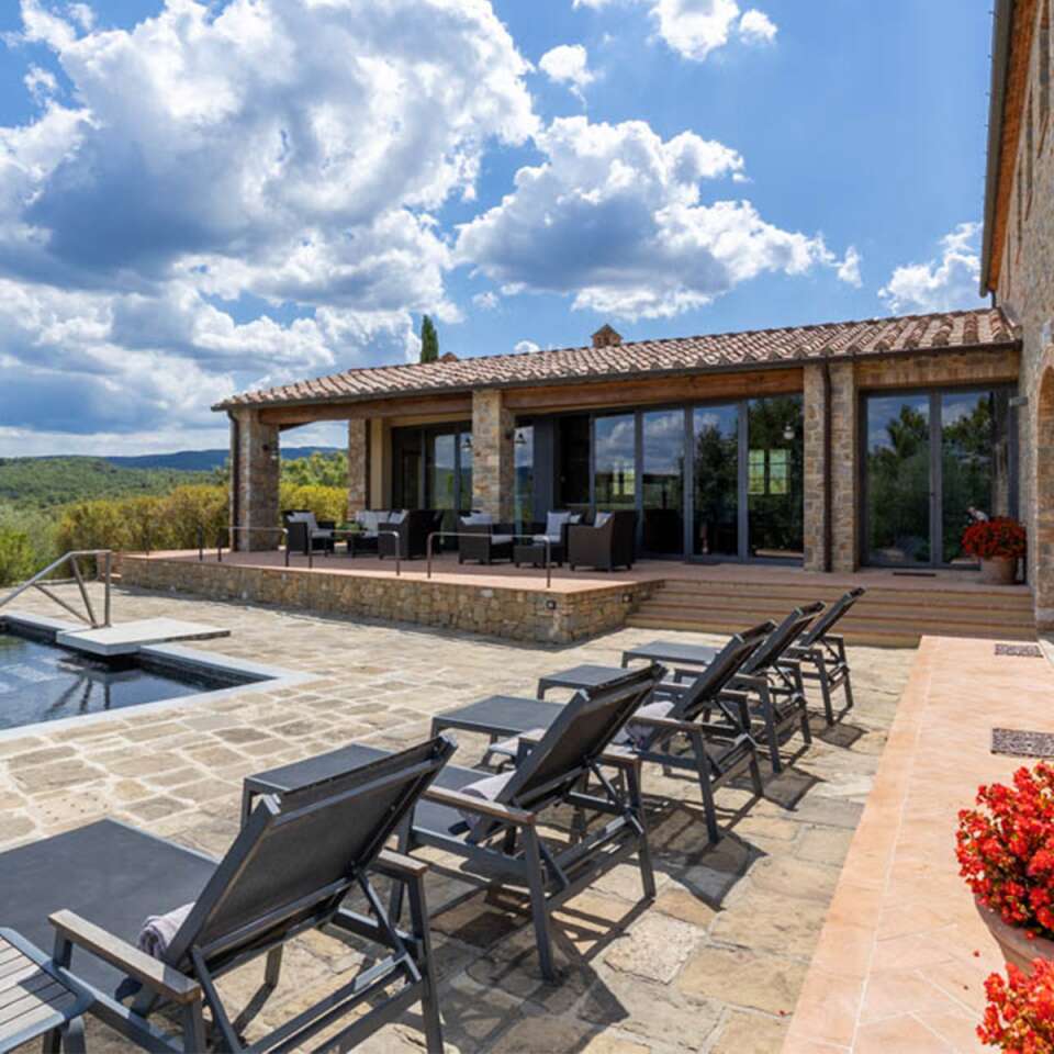 swimming pool with sunbeds