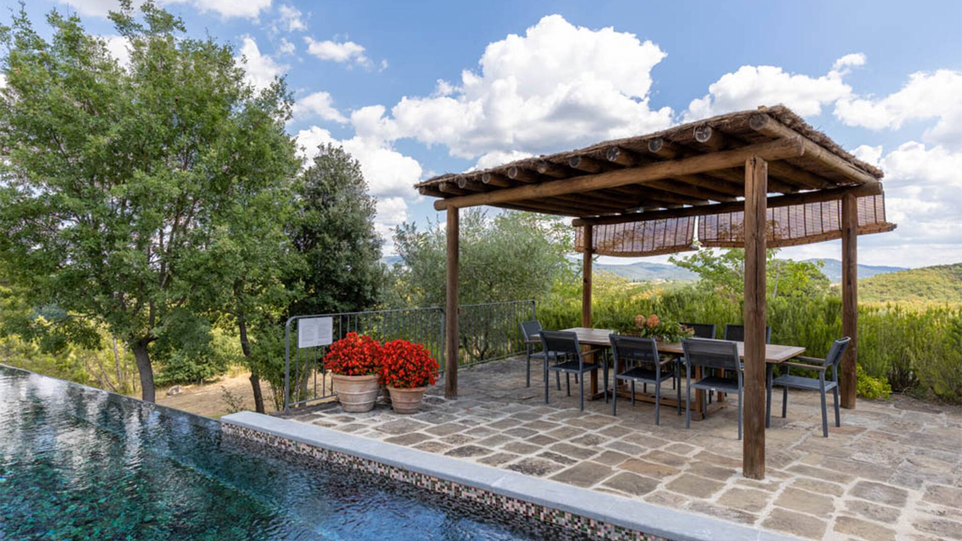 covered pergola by the swimming pool