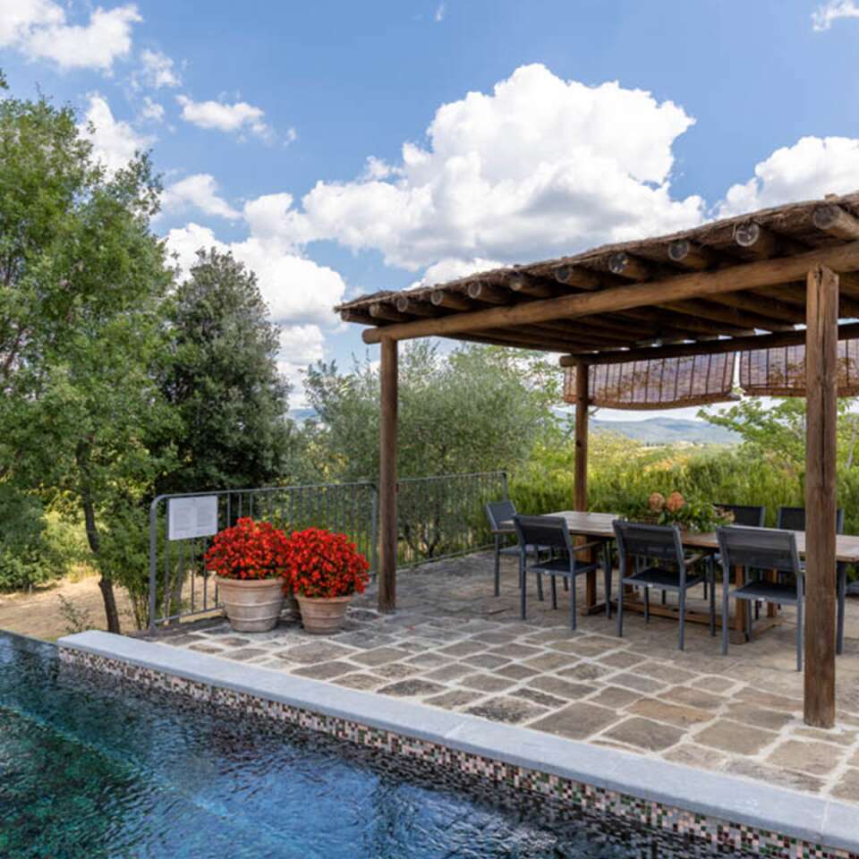 covered pergola by the swimming pool