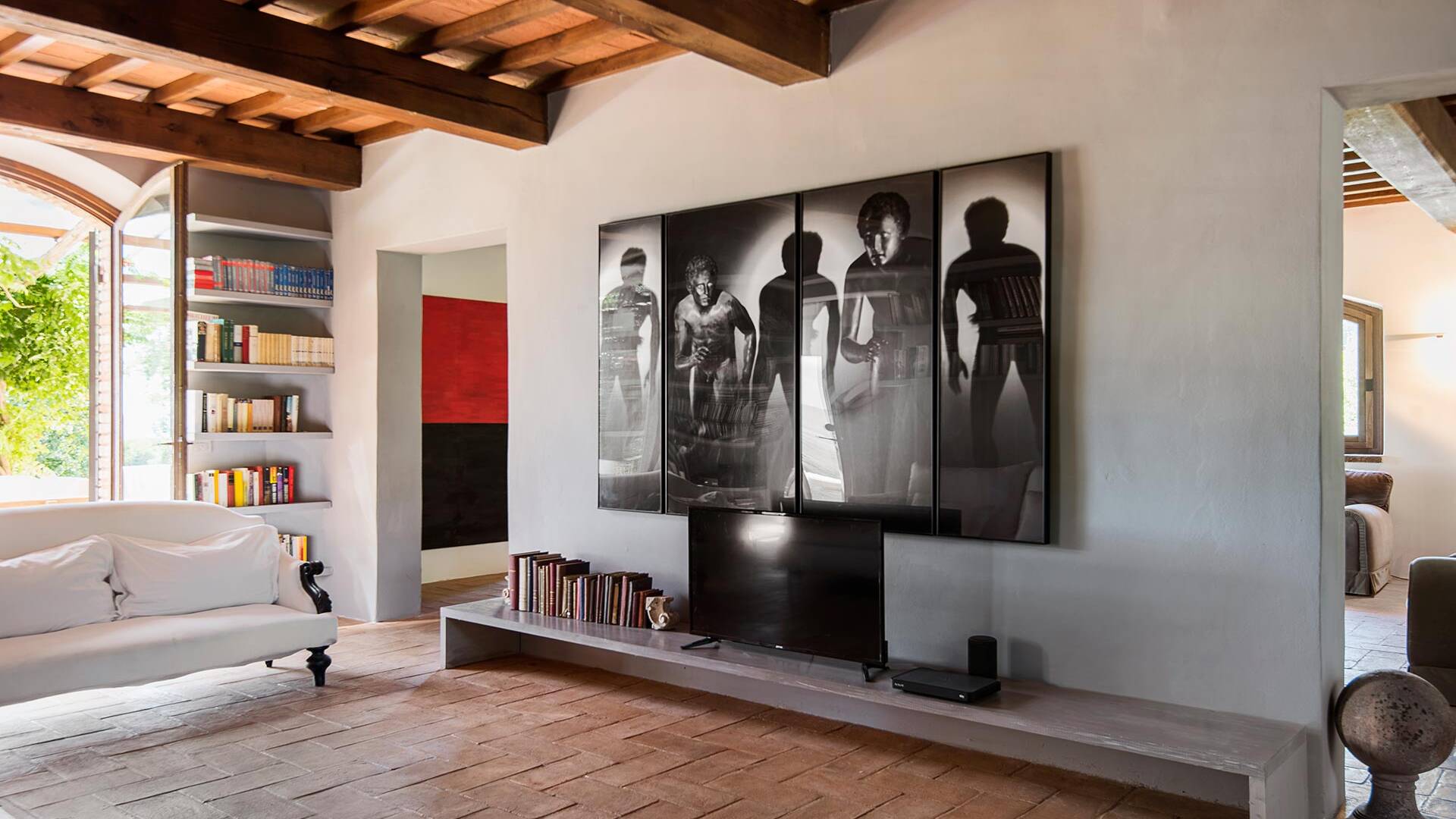 living room with library and TV