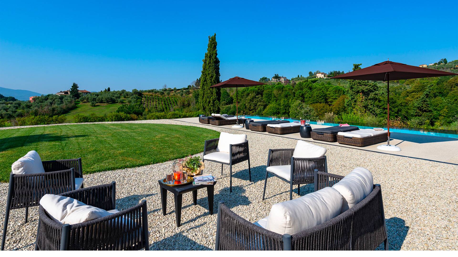 sunbeds and lounge area by the pool