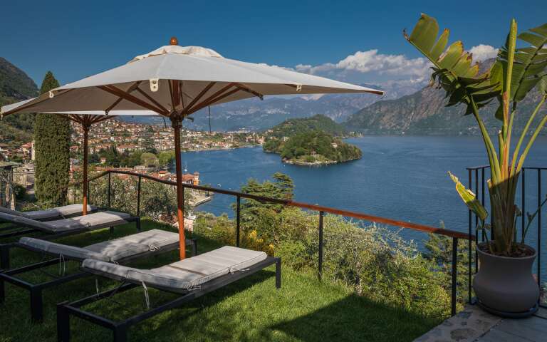 terraced garden with lounge area and lake view