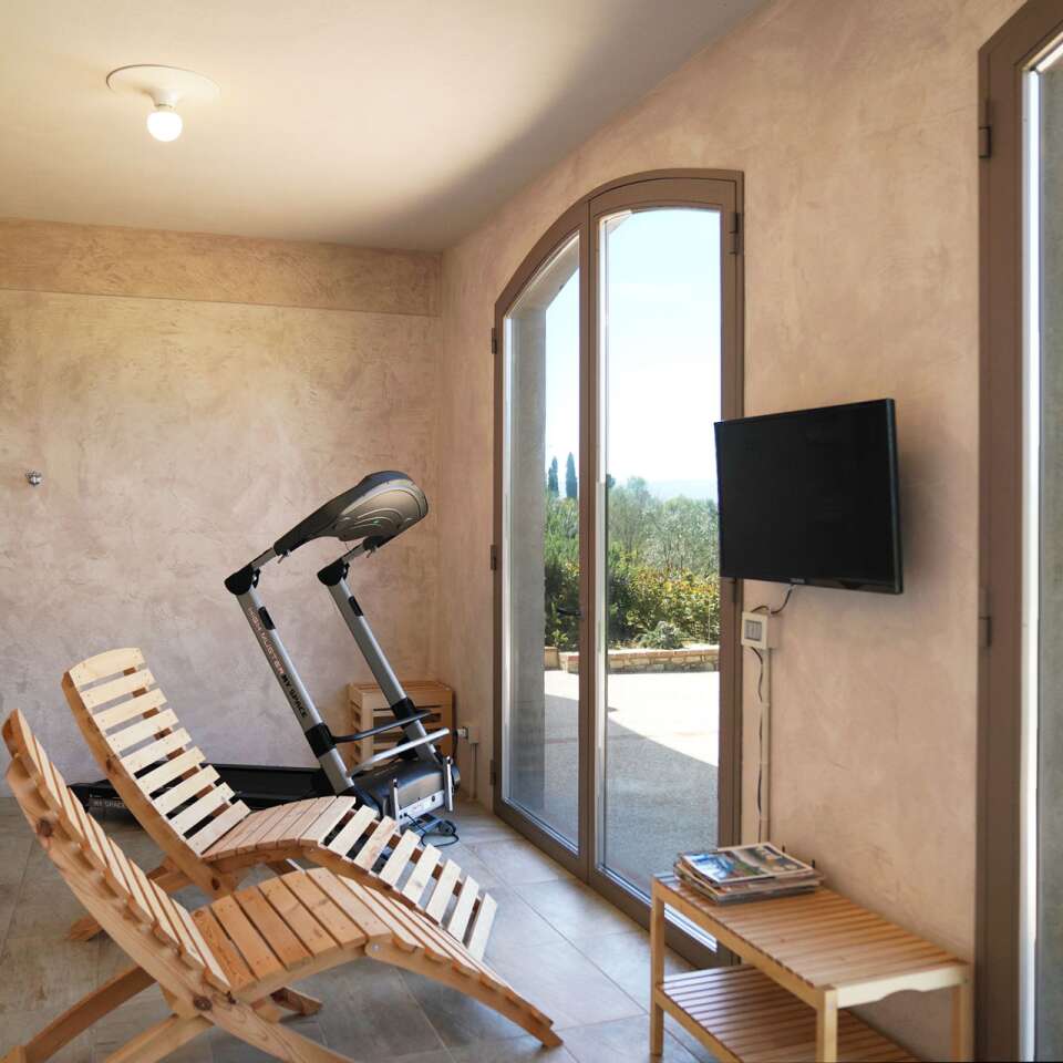 pool house with sauna and gym equipment