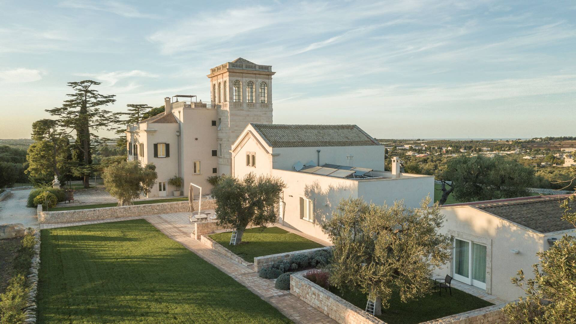 aerial view of guesthouses and main villa