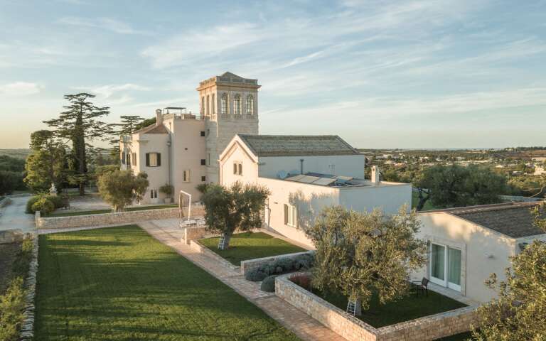 aerial view of guesthouses and main villa