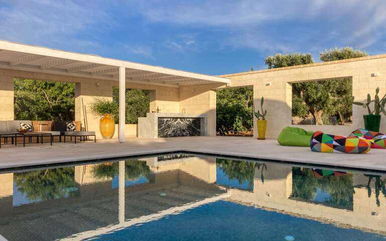 private swimming pool with sunbathing area