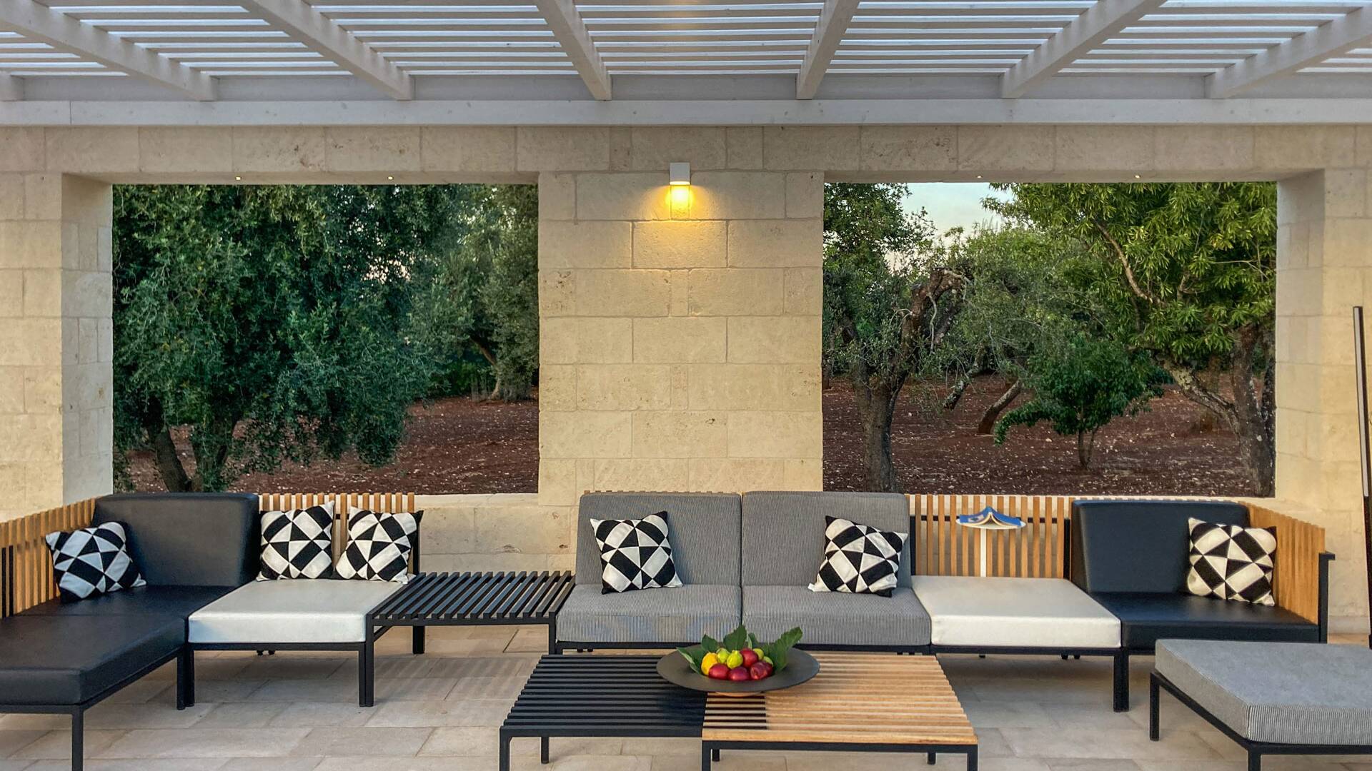 covered sitting area by the pool