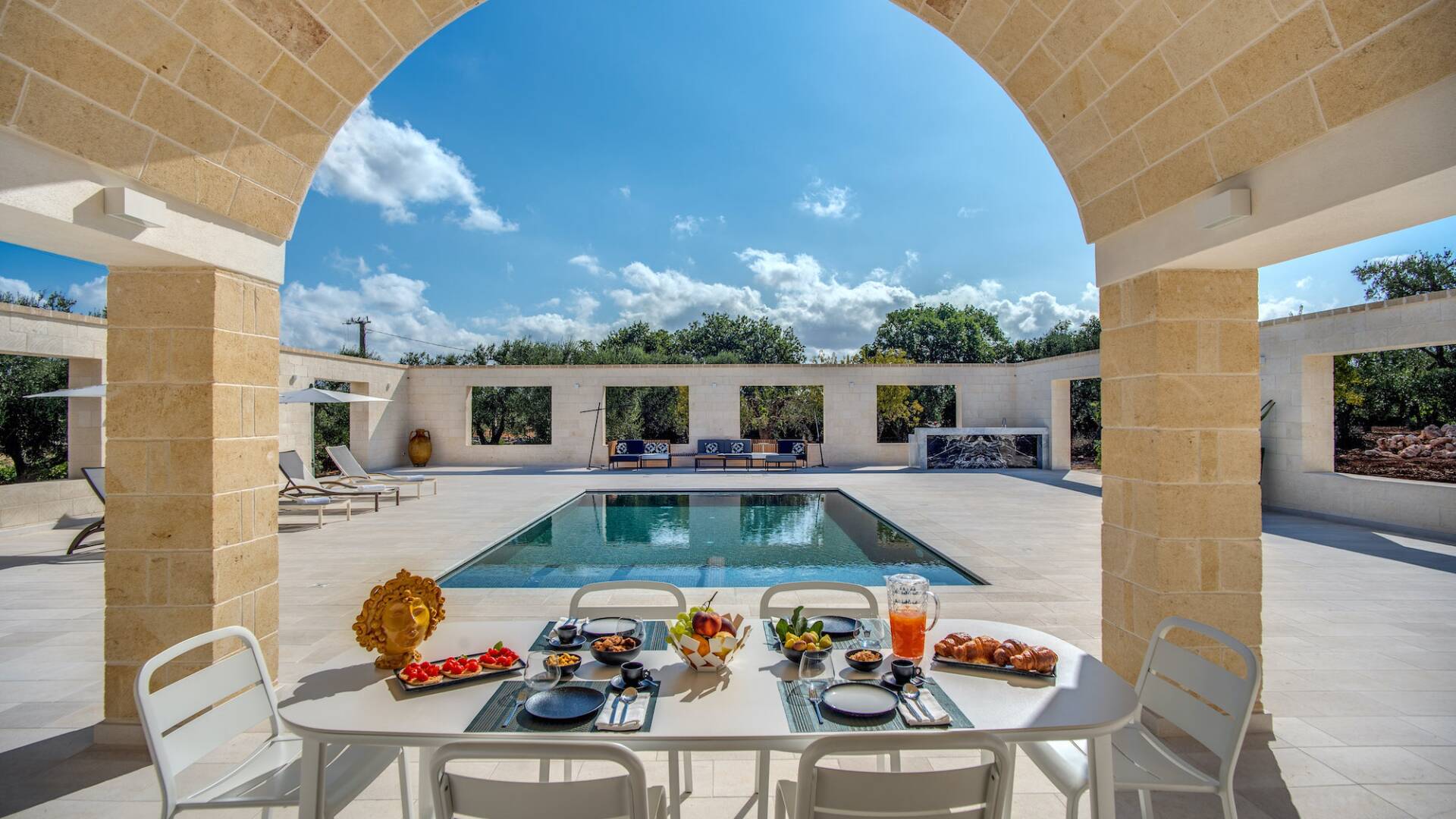 alfresco dining in front of swimming pool