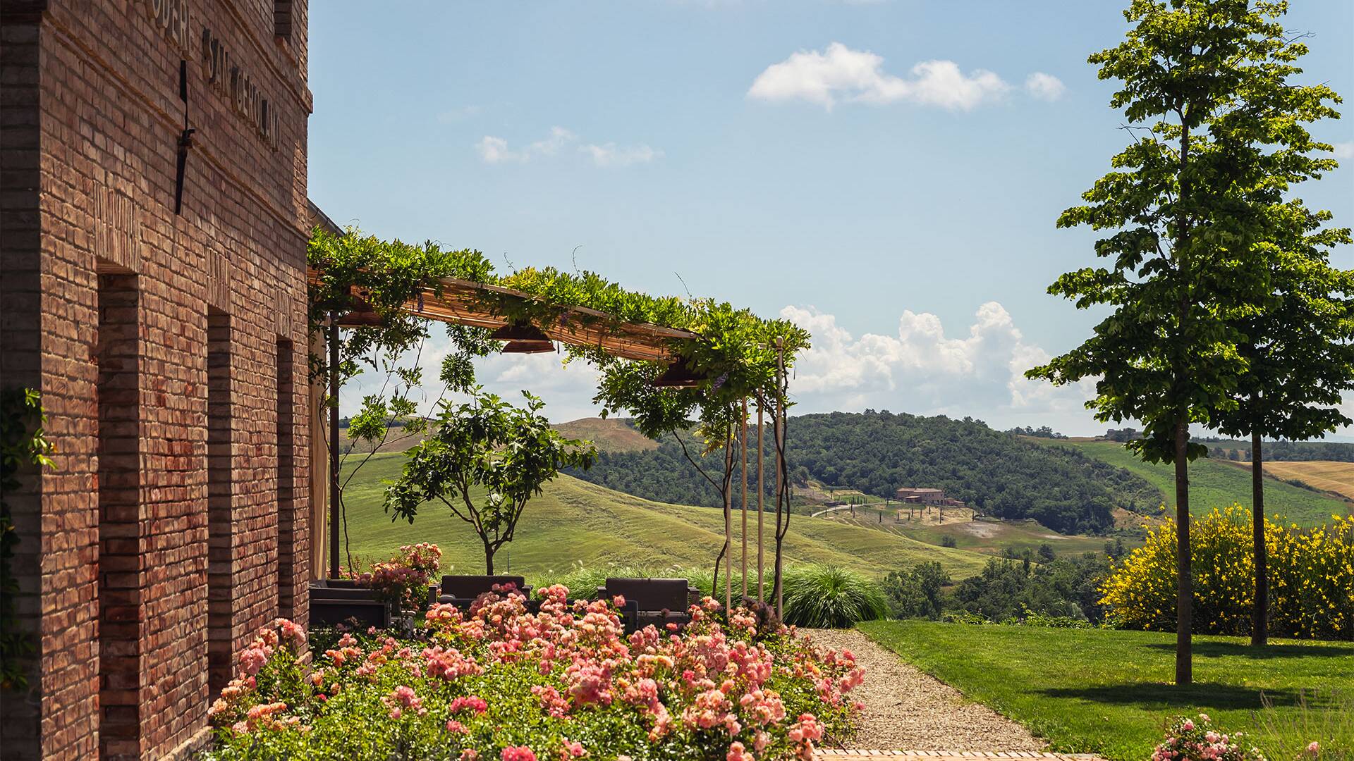 covered sitting area surrounded by Tuscan countryside