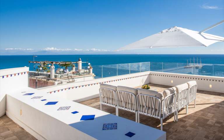 terrace with umbrella and sofa