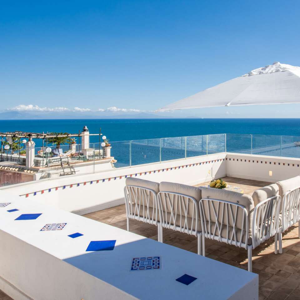 terrace with umbrella and sofa