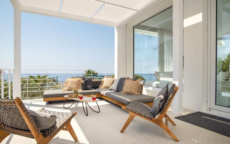 lounge area in front of the entrance of the villa