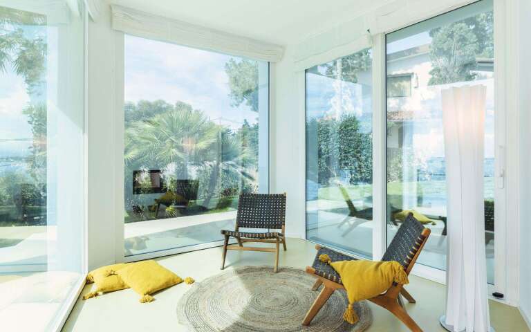 living room with French windows opening to outdoor 