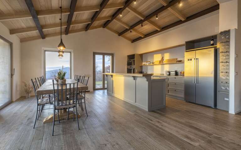 ground floor, kitchen with counter and dining table
