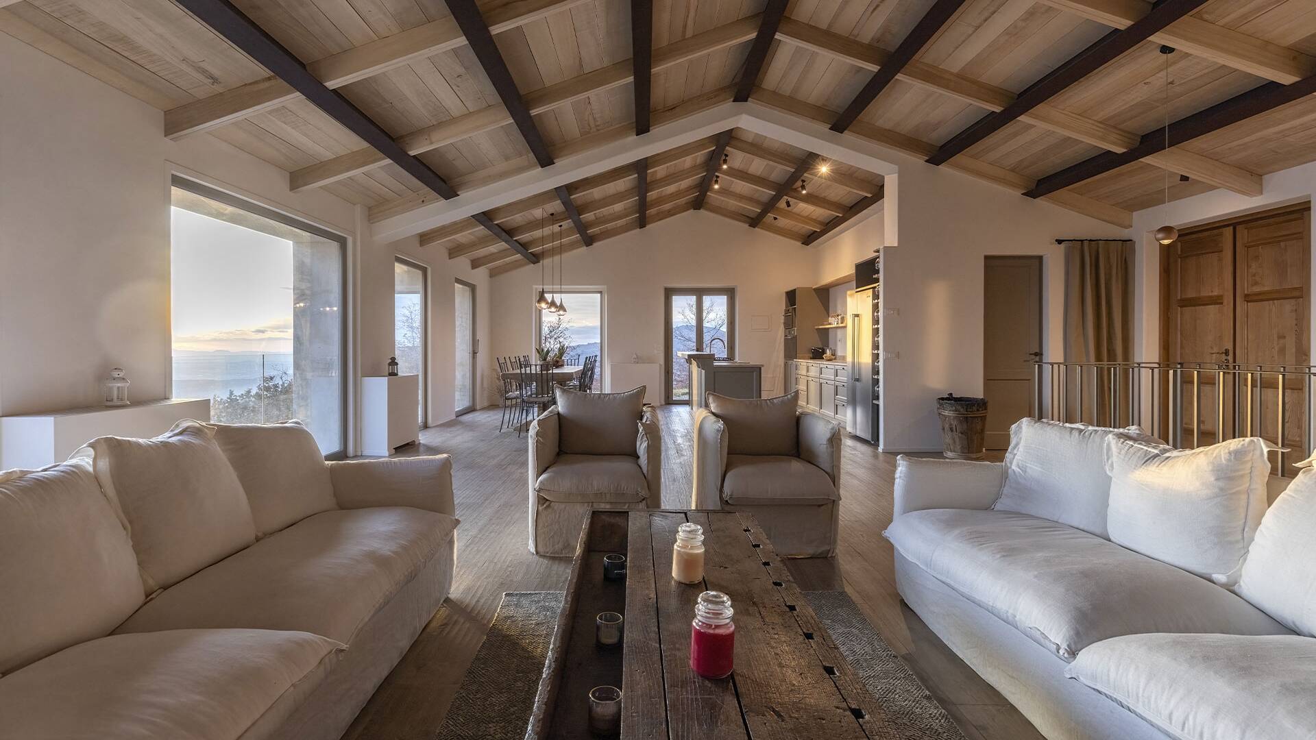 lounge area equipped with sofas and wooden table