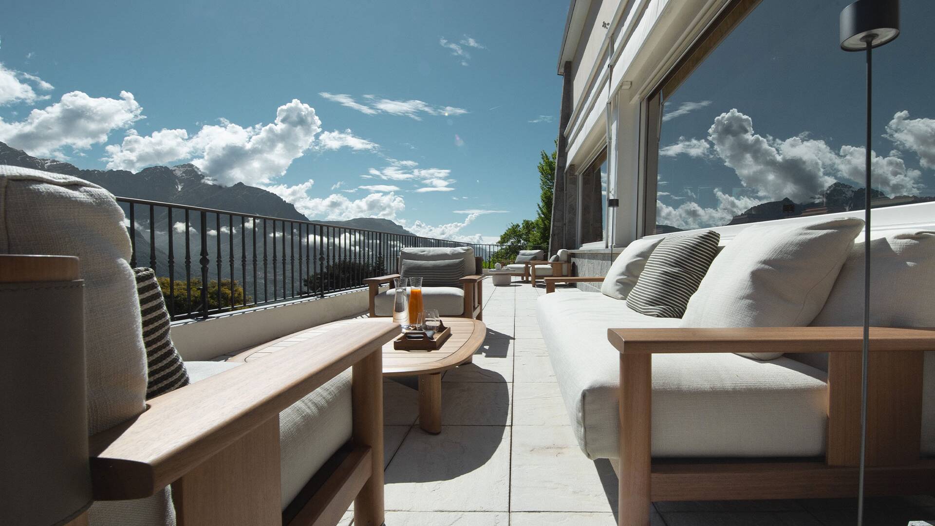 newly renovated balcony with comfortable lounge area and view on the lake