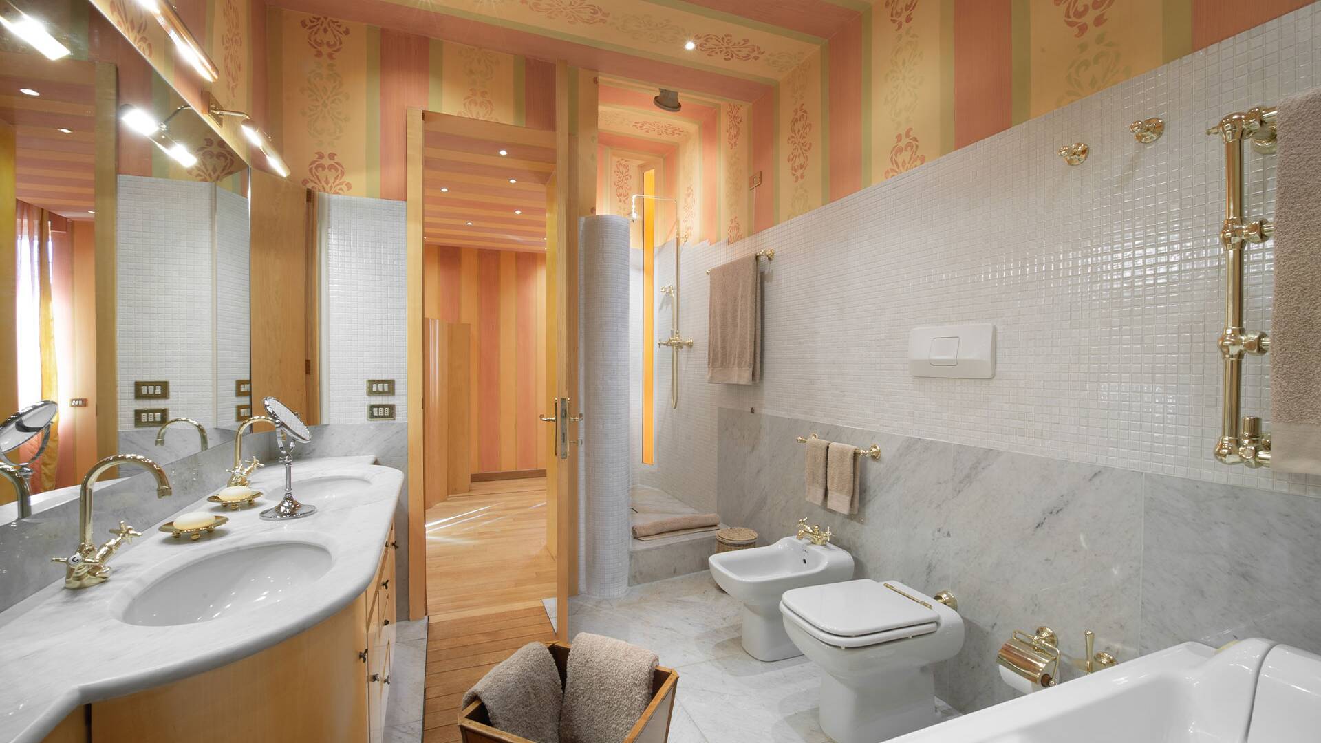 large bathroom with double sink, walk in shower and bath tub