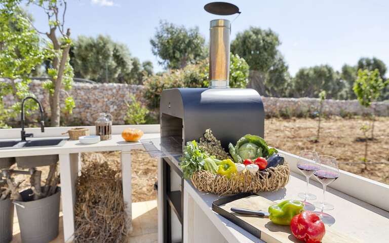 outdoor kitchenette with stone-made BBQ