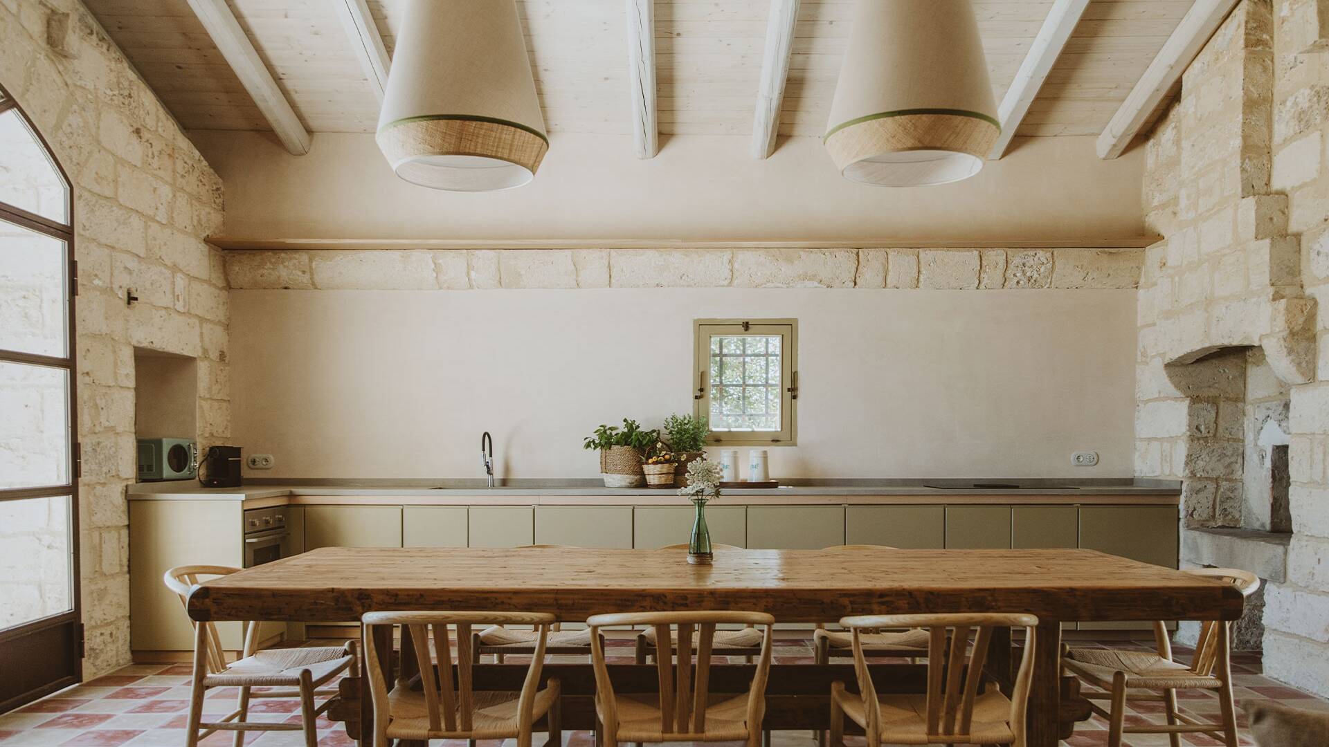 fully-equipped kitchen and large wooden table