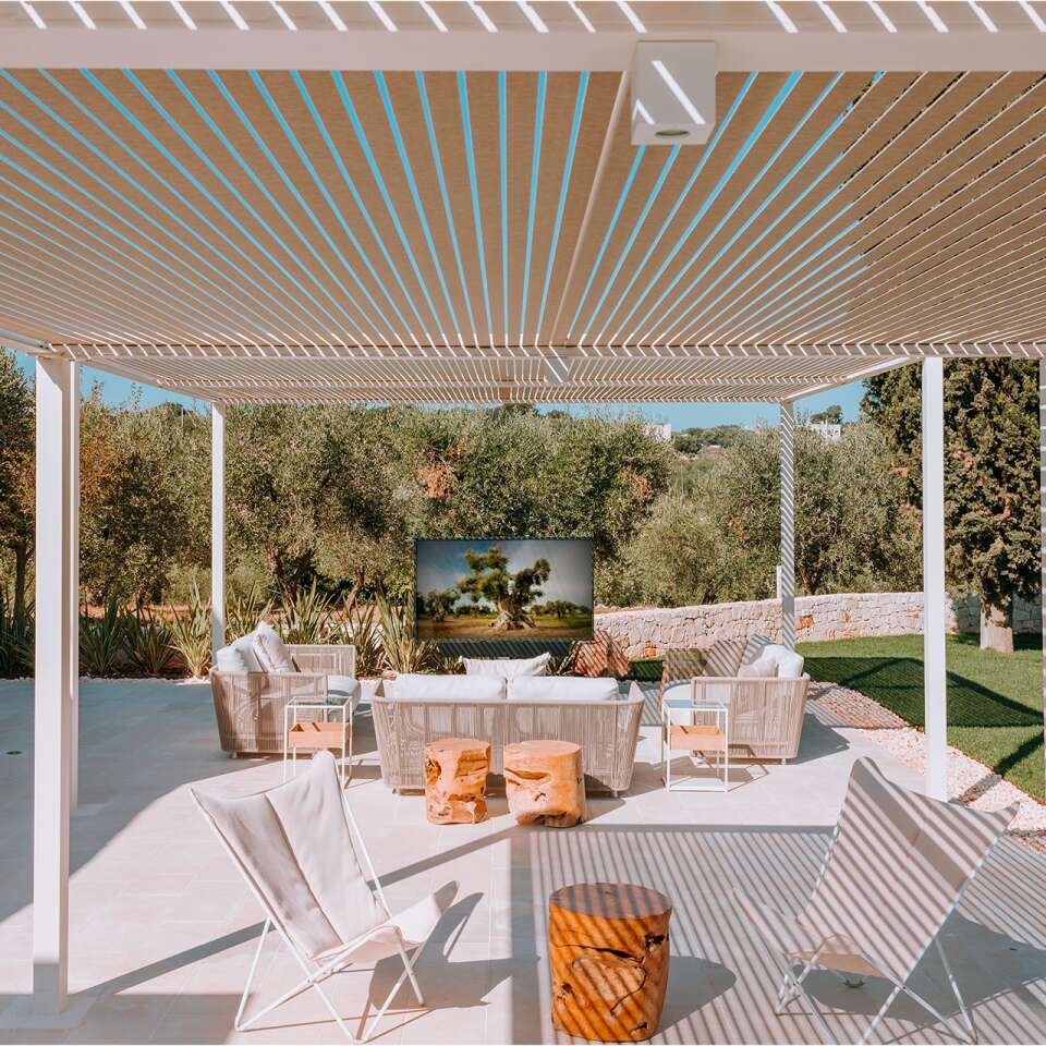 outdoor covered sitting area with TV