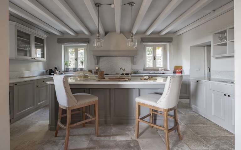 main villa, fully-equipped kitchen with counter and stools