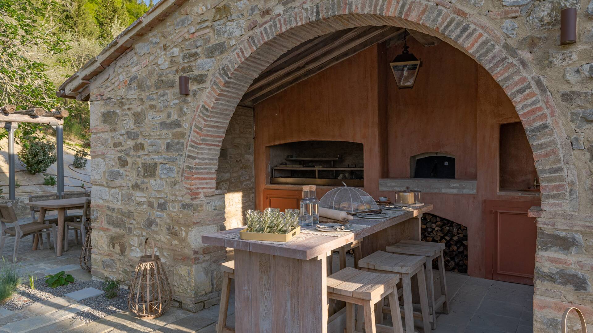 covered pergola with pizza oven, grill and beer tap