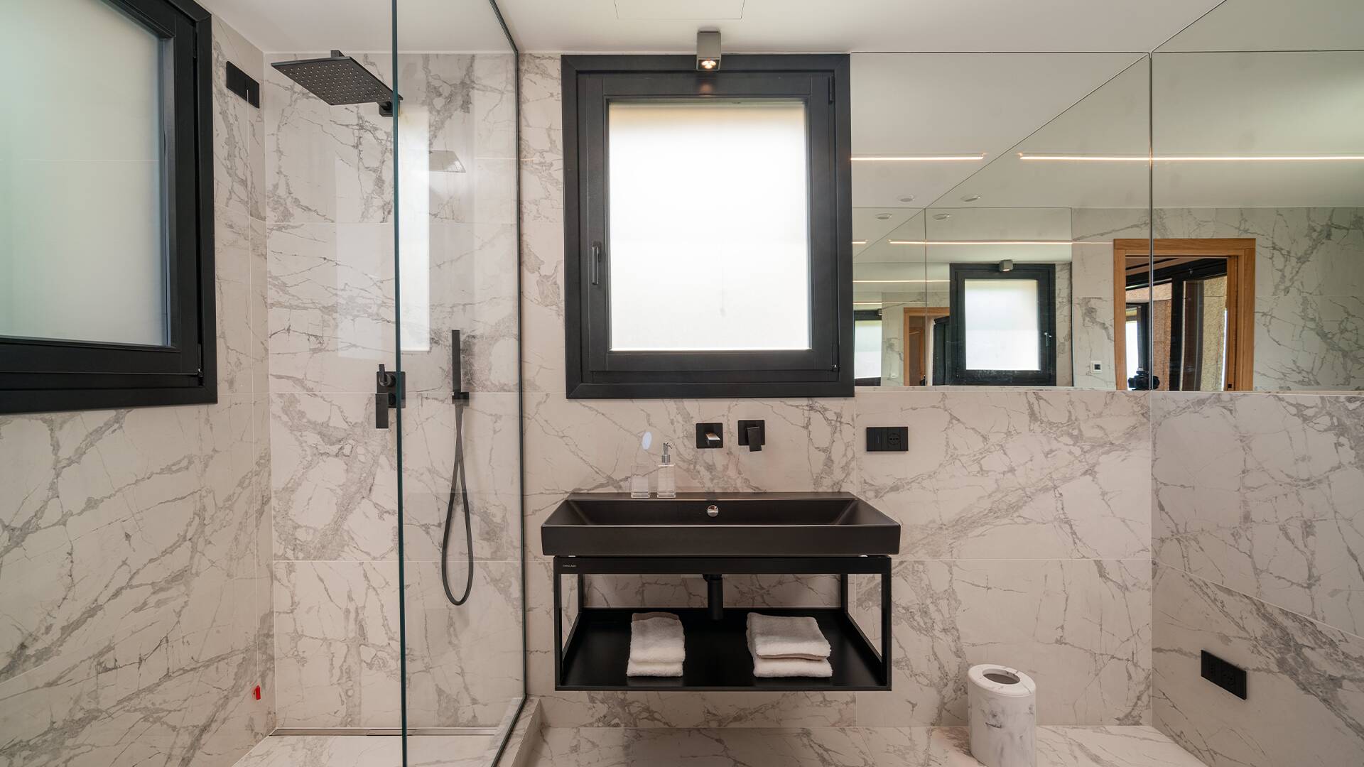 marble bathroom with shower cabin