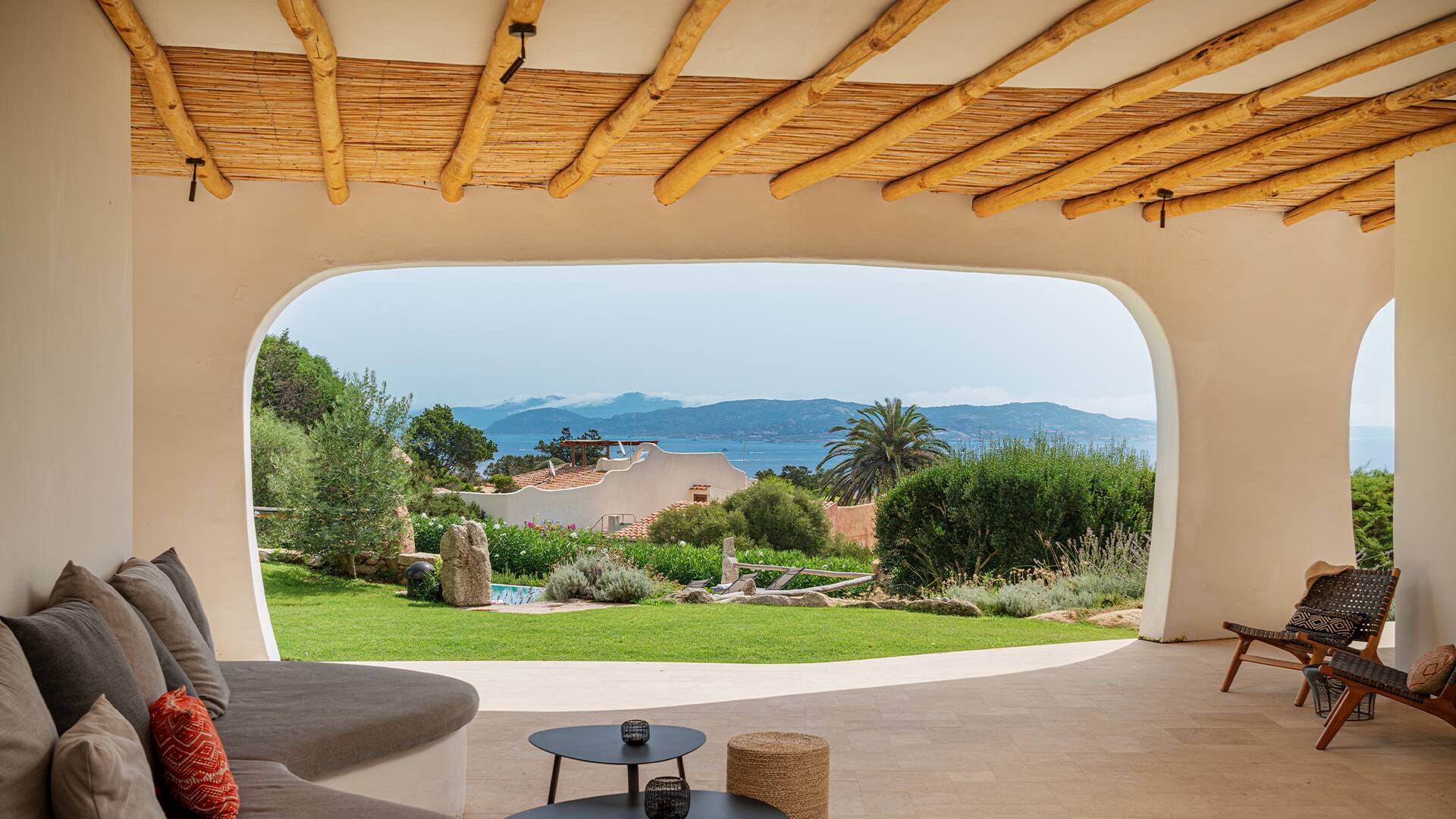 covered pergola with pool and sea view