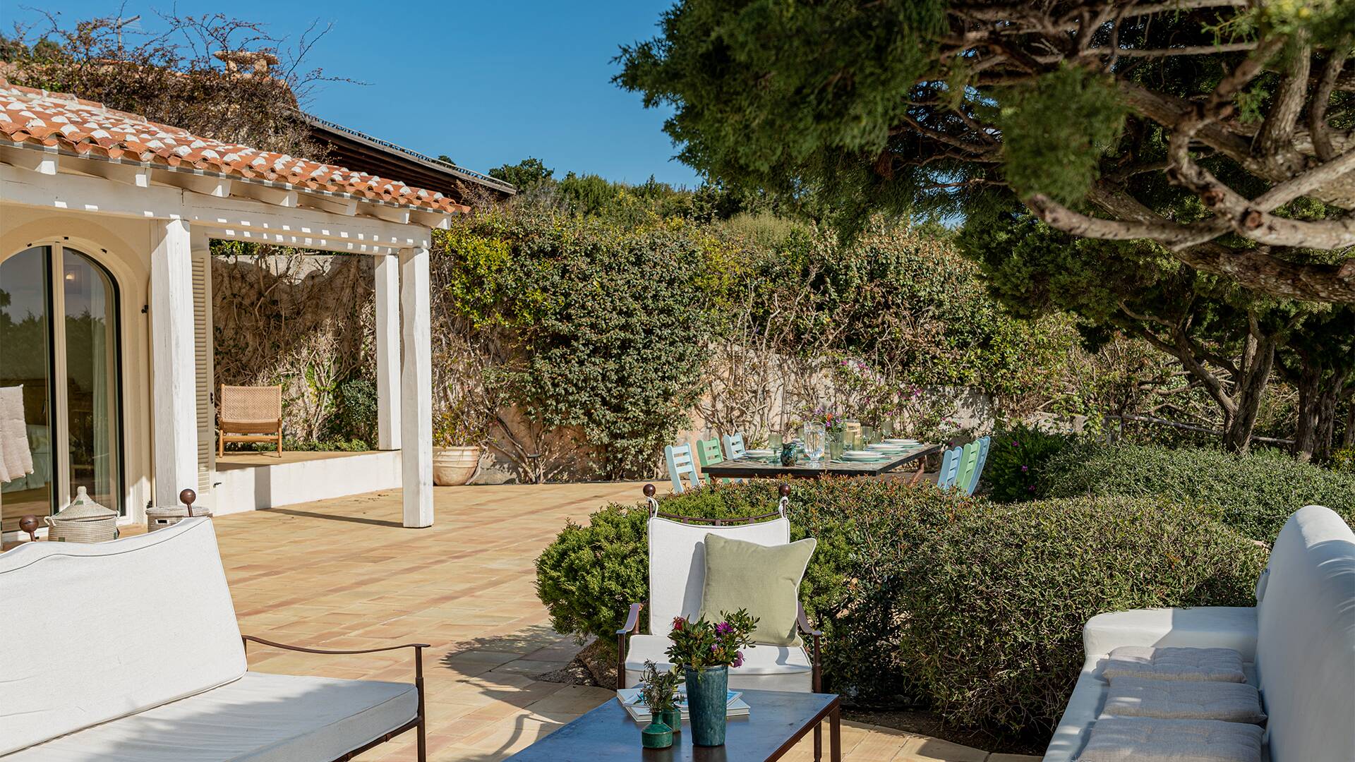 outdoor sitting area with sofas and coffee table