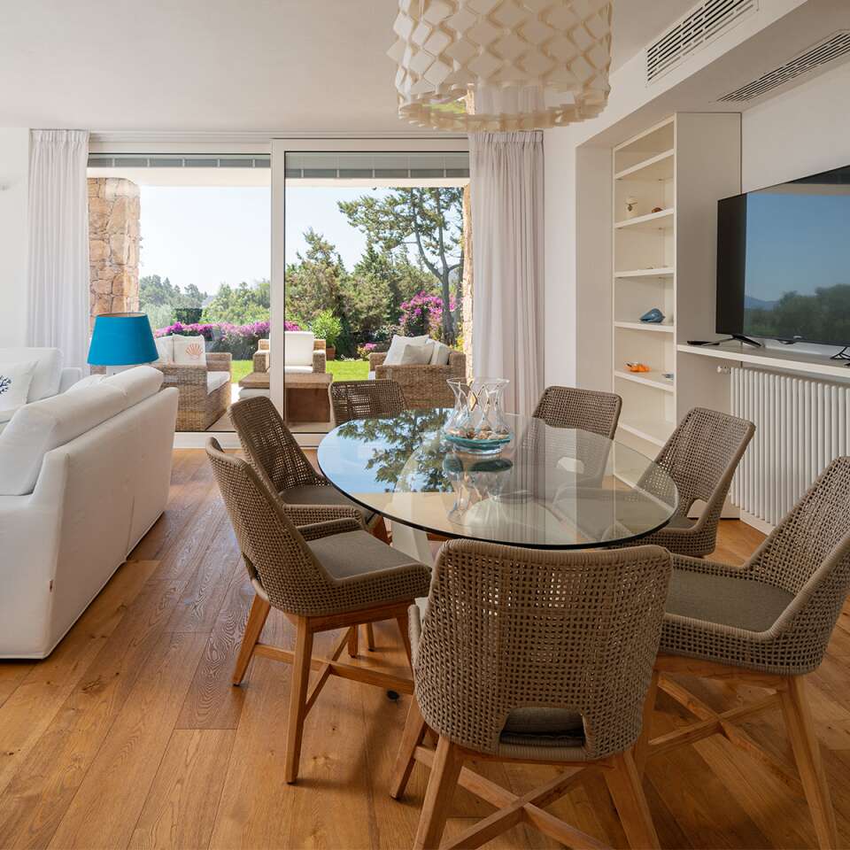 dining table and living room with TV