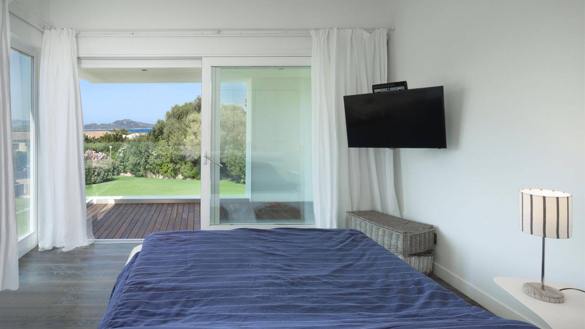 double bedroom with French windows and sea view