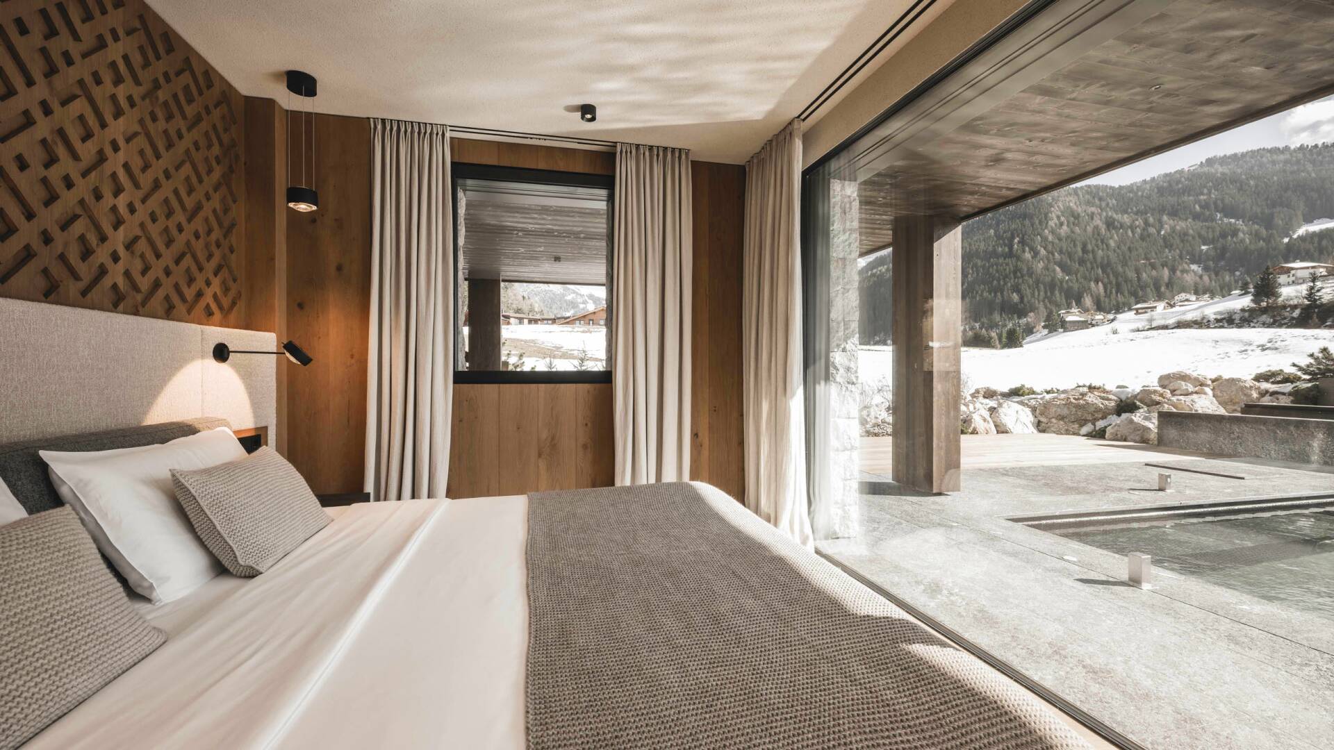 double bedroom with pool and alpine views