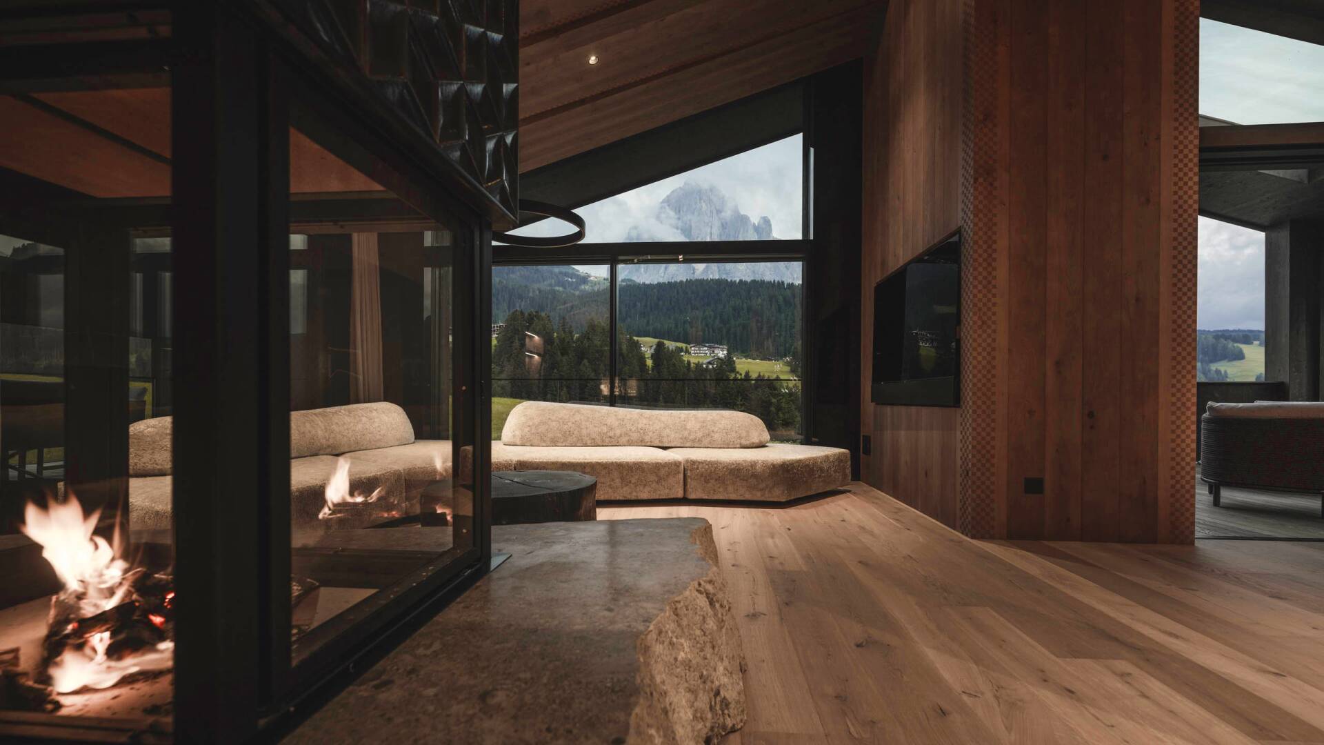 sitting area with fireplace, TV and sweeping mountain views