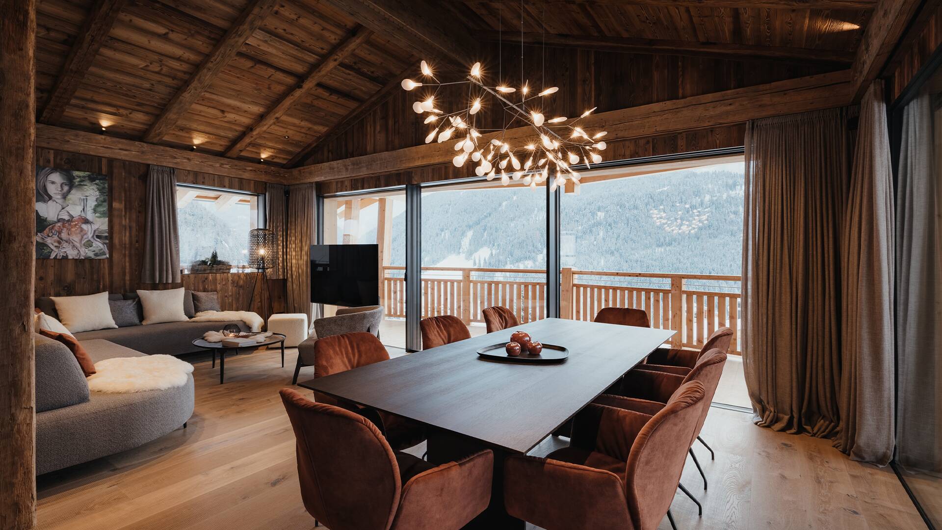 cosy dining area and living room with majestic windows