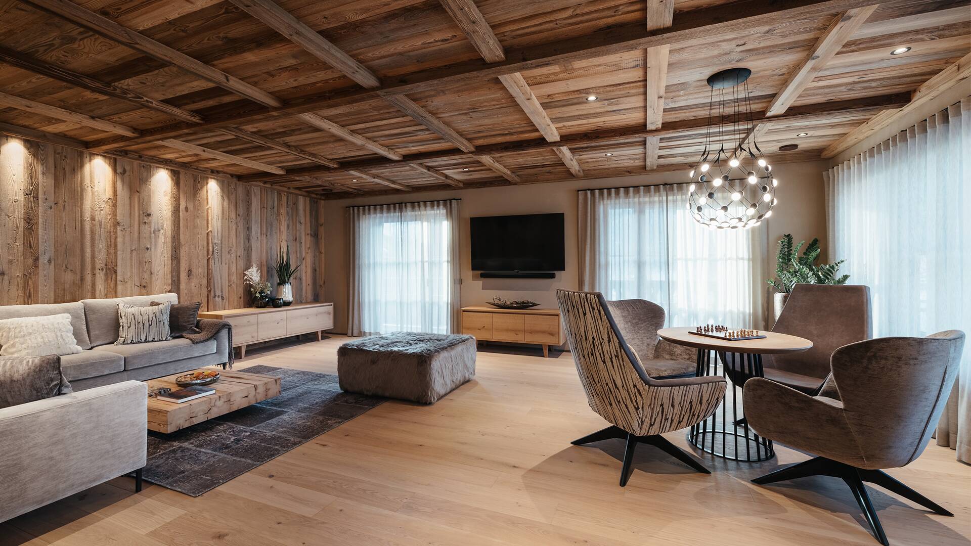 living room with sitting area and TV