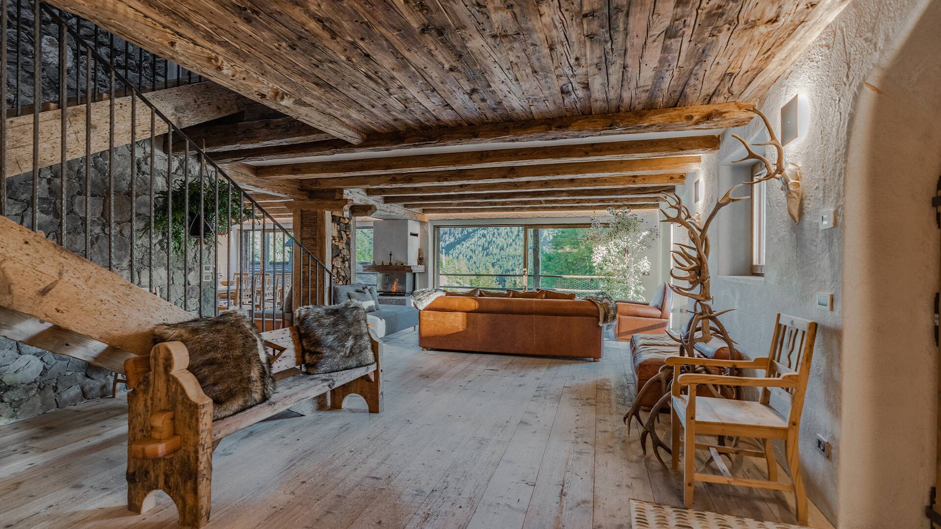 cosy living area with wooden architecture and French windows