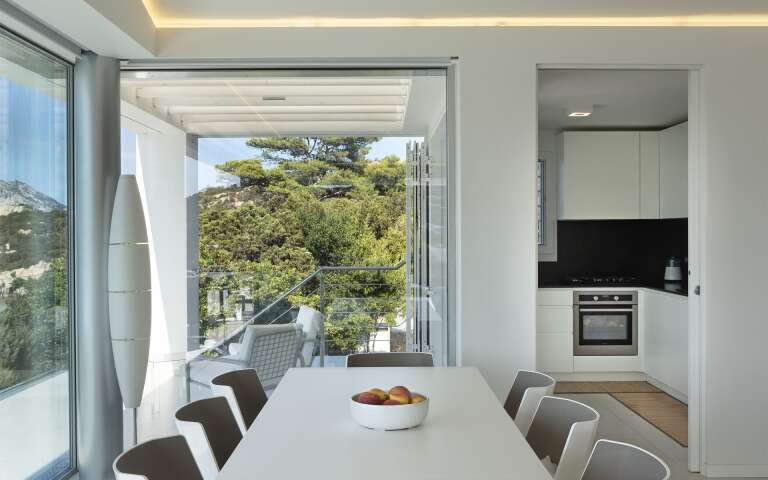 dining table and well equipped kitchen