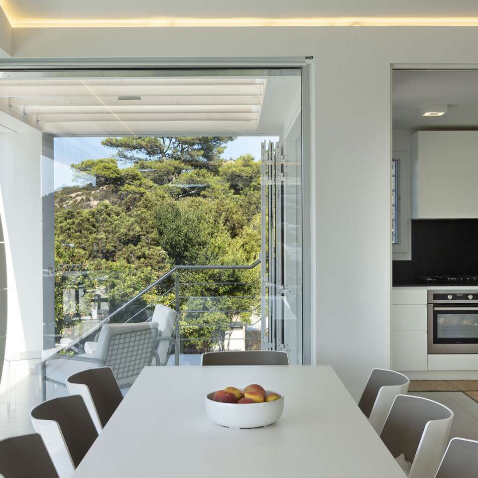 dining table and well equipped kitchen