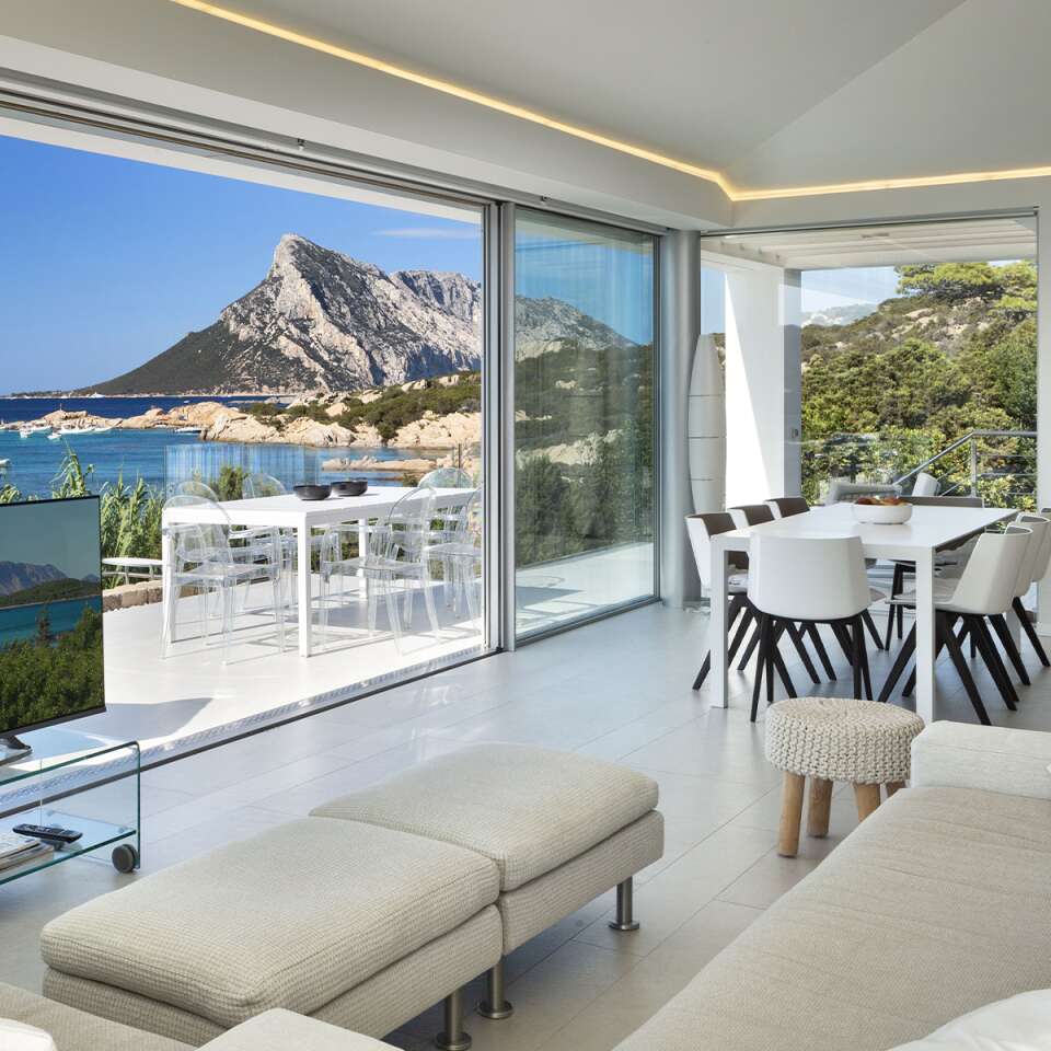 dining area and sofa with TV