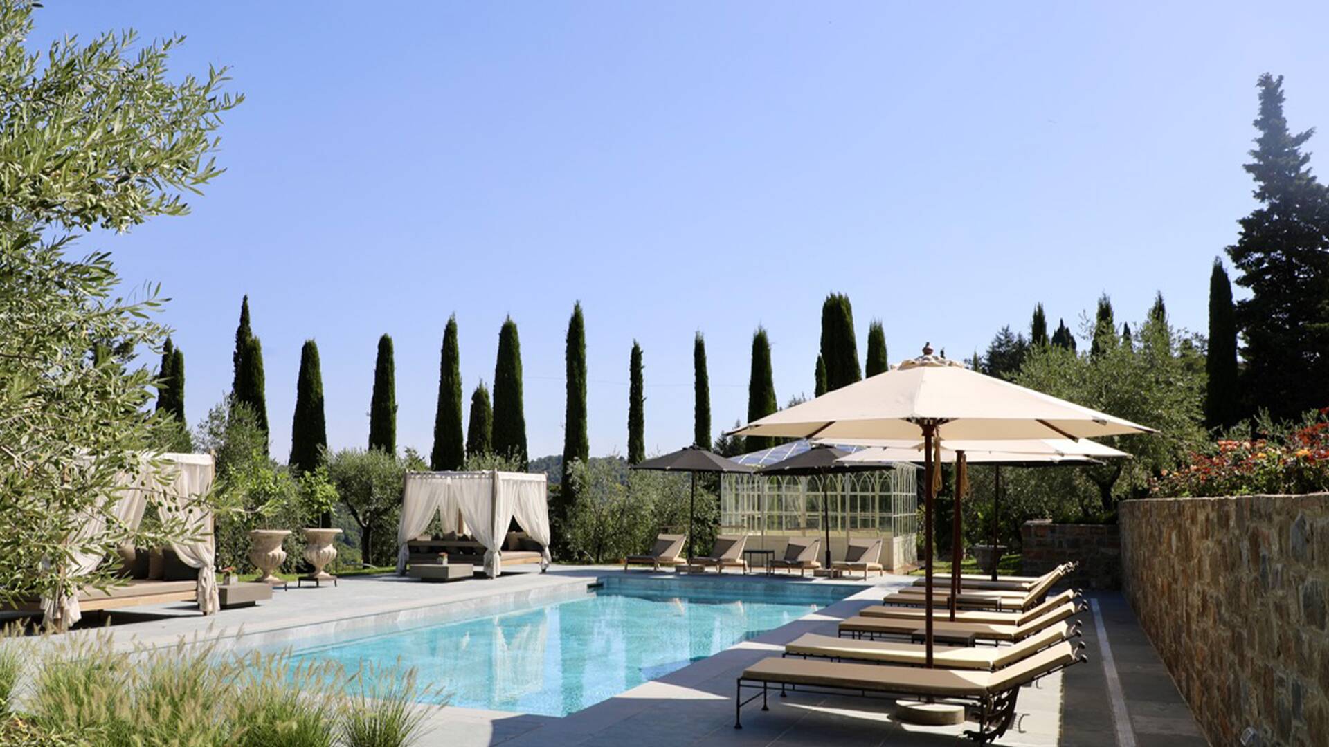 private swimming pool with sunbathing area