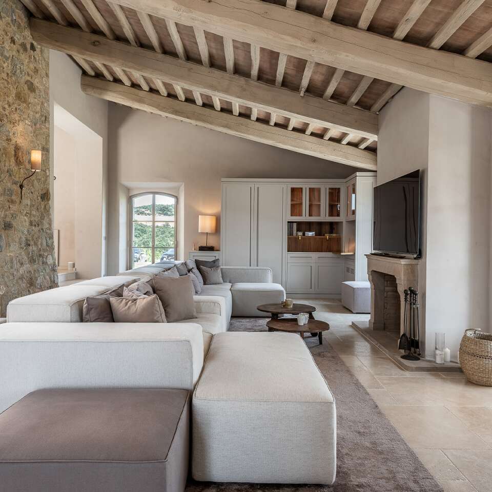 living room with large sofa, TV and fireplace