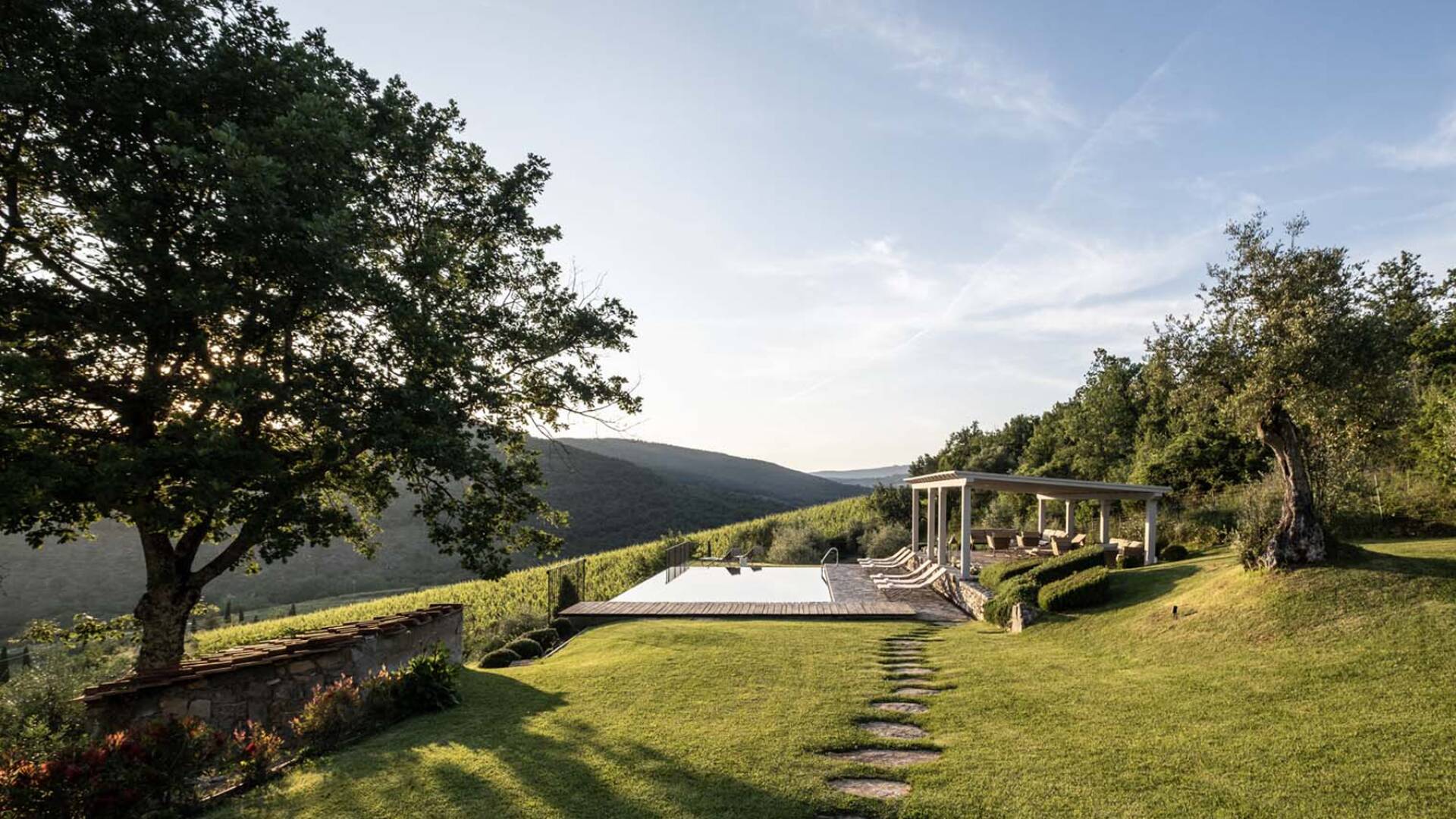 swimming pool with covered sitting area