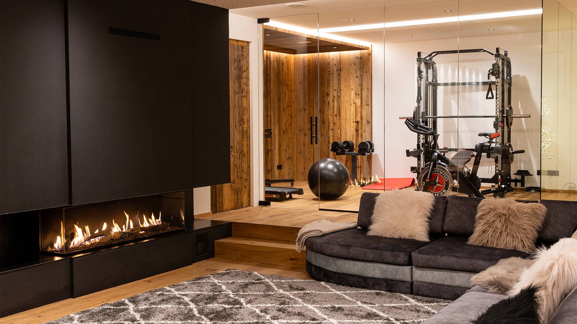 living room with fireplace and gym