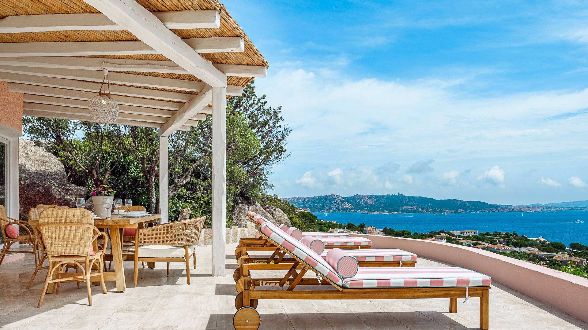sunbeds and covered pergola