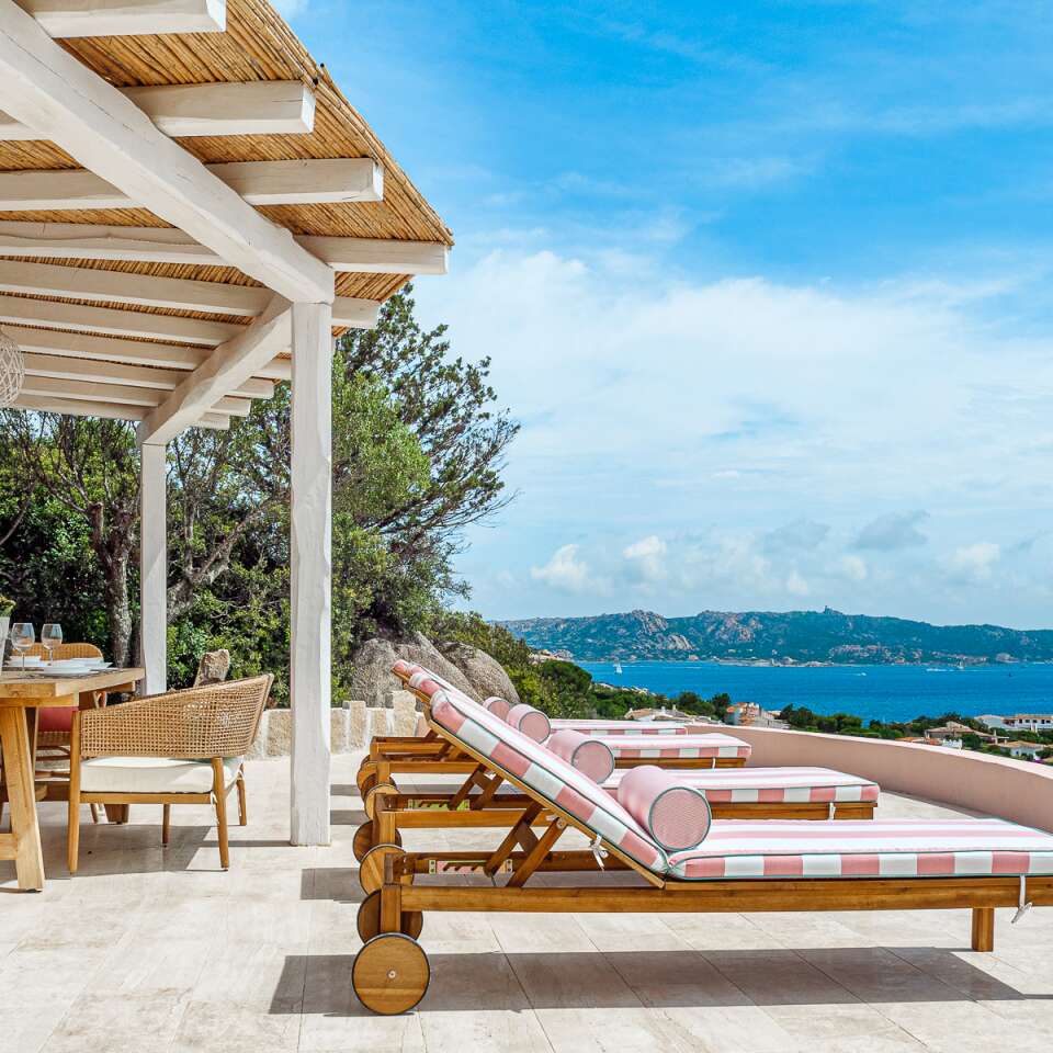 sunbeds and covered pergola