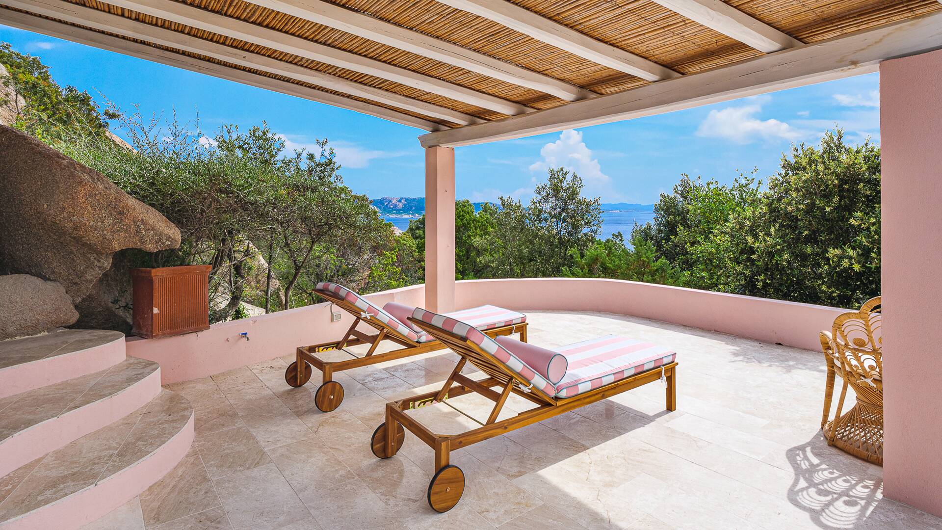 covered pergola with sunbeds